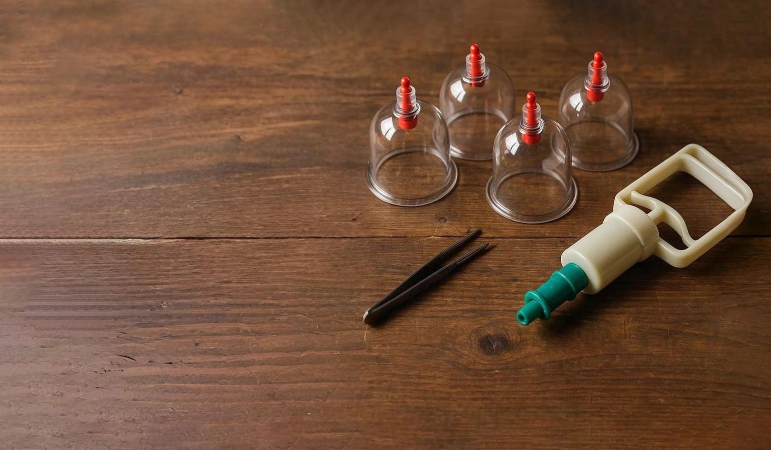 Traditional Hijama cupping set with glass cups on a wooden table